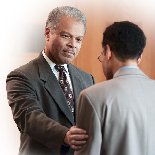 An elder welcomes a brother who has approached him