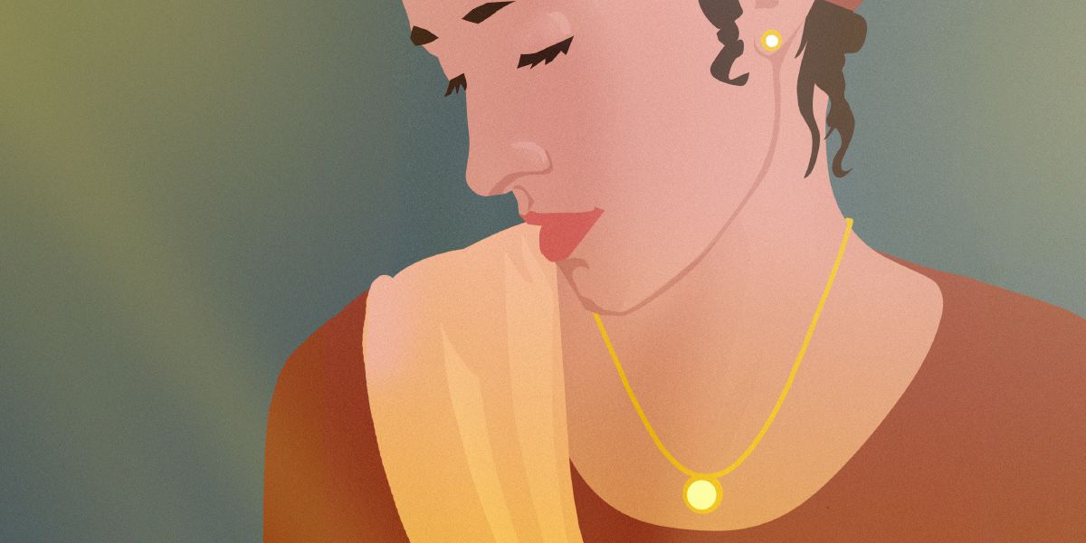A woman wearing a necklace