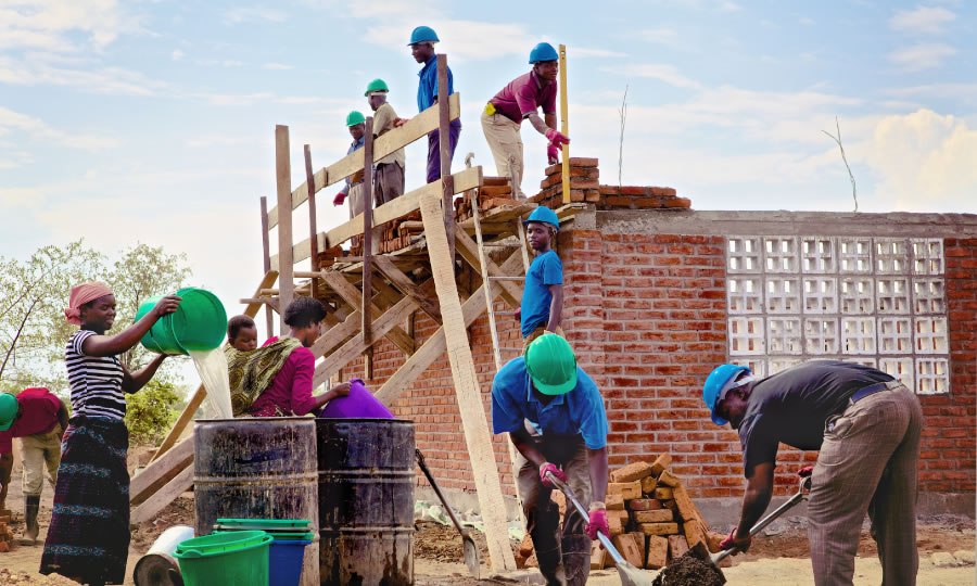 Witnesses building a Kingdom Hall in a land with limited resources