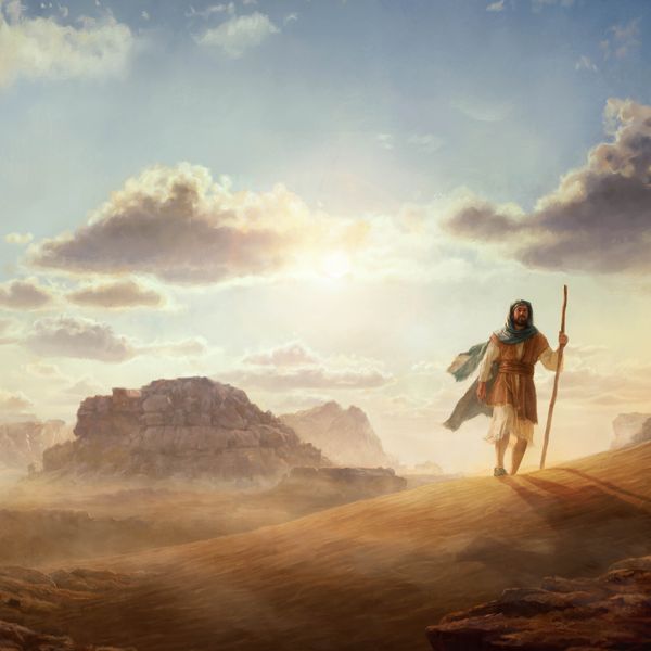 A man in Bible times walking across a vast desert landscape.