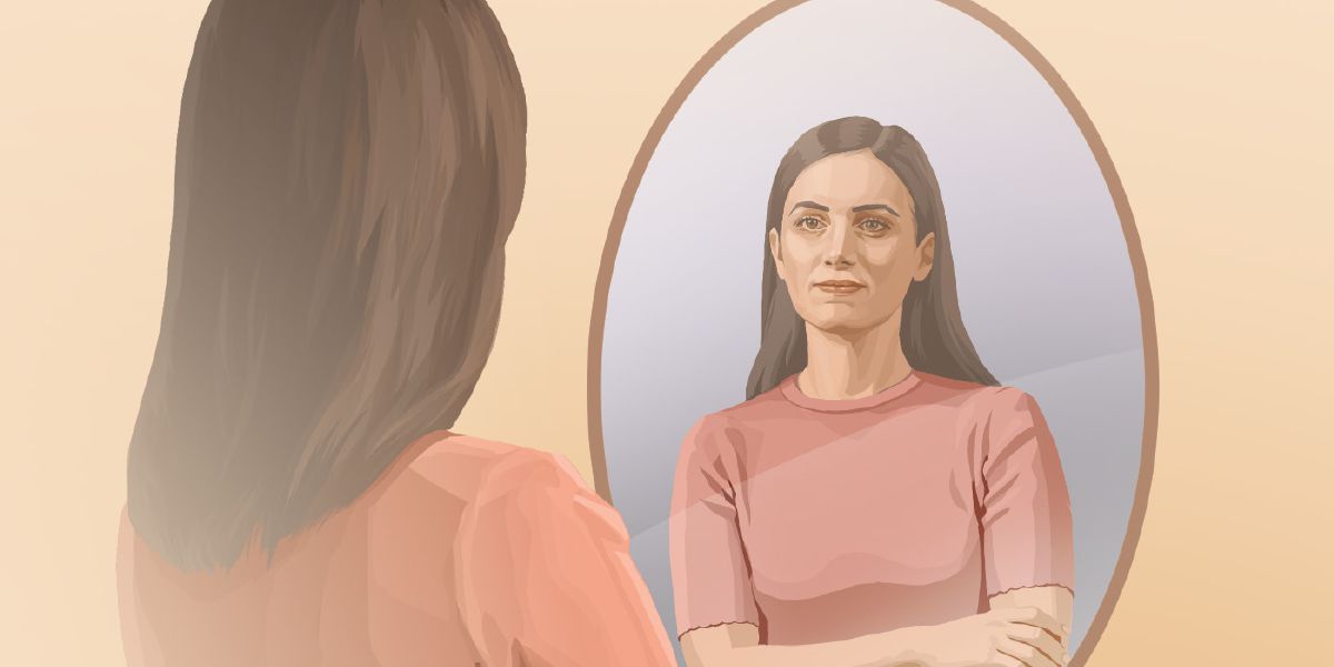A sister meditates as she looks in a mirror