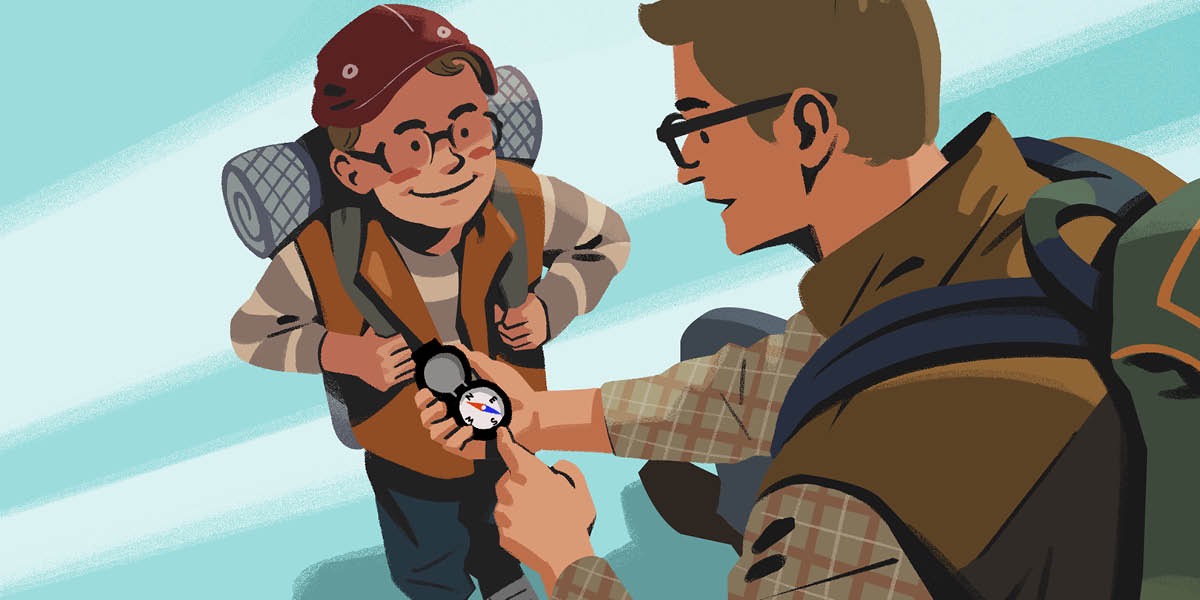 Father and son use a compass for direction