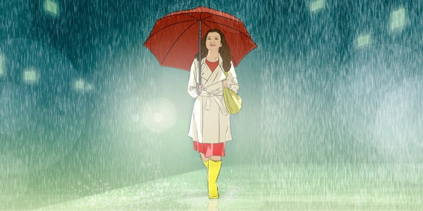 一個女孩走在雨中