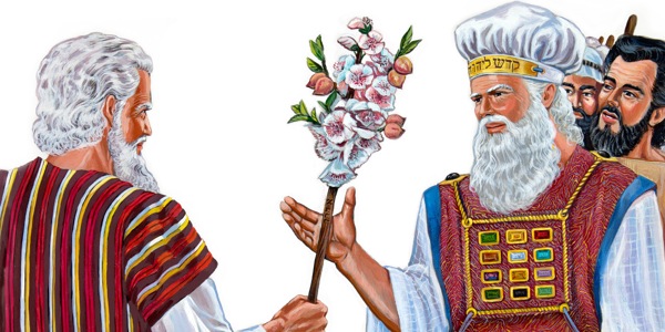 Mojžíš drží Áronovu hůl, která vyrašila