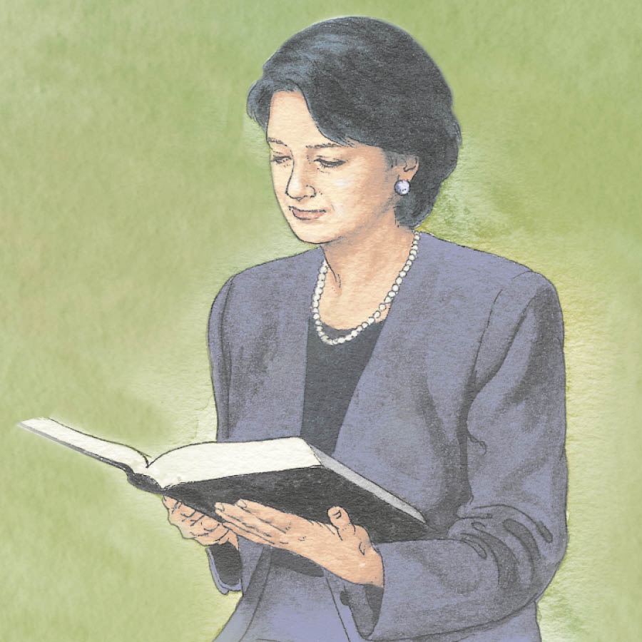 Una señora leyendo la Biblia
