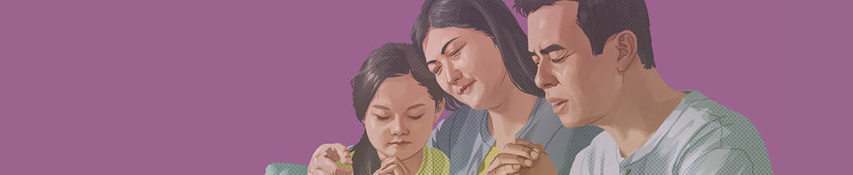 Un padre orando con su esposa y su hijita.