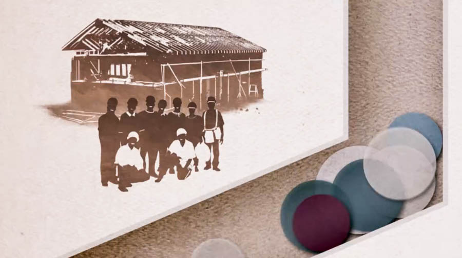 Una imagen del video Llenemos nuestra mano con una dádiva para Jehová: Los fondos se usan para construir edificios para adorar a Jehová.