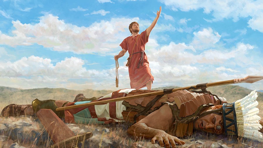 Goliat en el suelo bocabajo con una piedra hundida en la frente. David, junto a Goliat, lleva la honda en una mano y levanta la otra para alabar a Jehová.