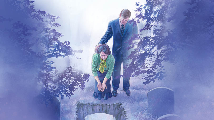 En un cementerio, un matrimonio llora y mira un ataúd que está dentro de una tumba.
