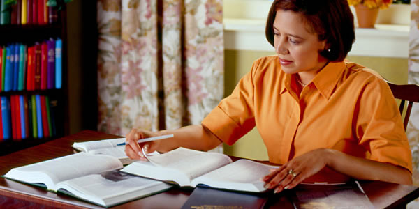 A sister studying the Bible and Bible-based publications.