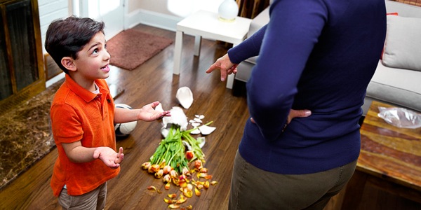 A little boy denies that he broke a vase