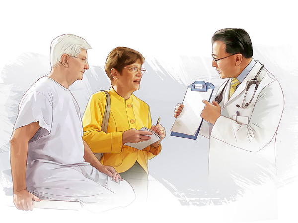 As a doctor meets with a couple, the wife takes notes
