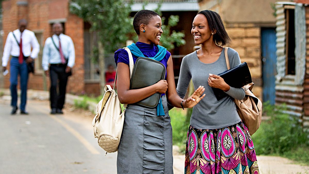 Two sisters joyfully working together in the ministry.