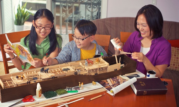 A family in the United States building a model of Noah’s ark
