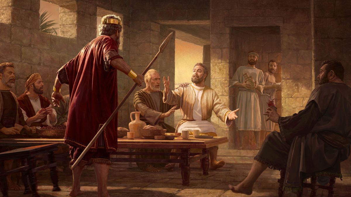 El rey Saúl de pie con una pose amenazante delante de Jonatán, que está sentado junto a una mesa con alimentos hablando en defensa de David. Abner y otros hombres que hay en la habitación ven la escena preocupados.