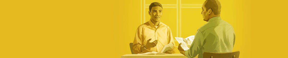 Un jeune homme étudie la Bible avec un Témoin de Jéhovah.