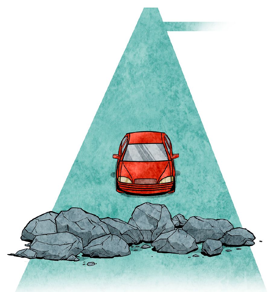 Une voiture arrive devant un barrage sur la route