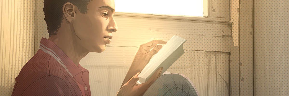 Un joven leyendo la Biblia.