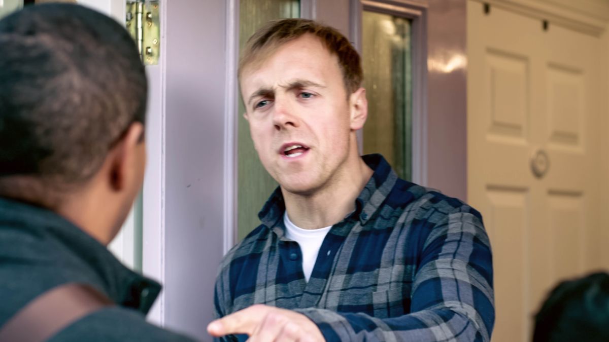 One picha from da video “Show Love Wen You Go Preach.” Da faddah an his boy in service an da guy at da door giving dem hard time.