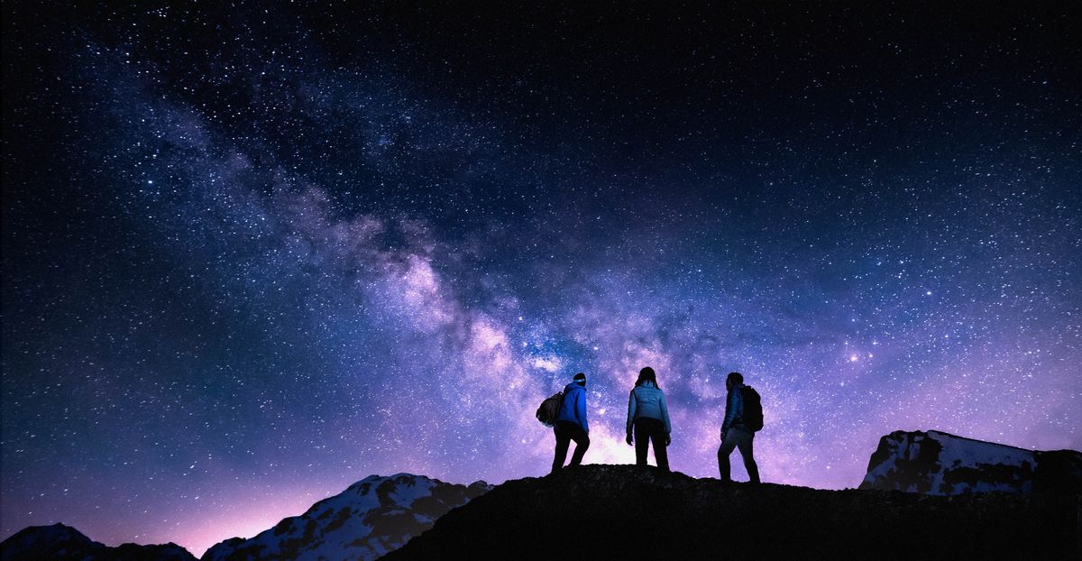 Some guys hiking an looking at da stars.