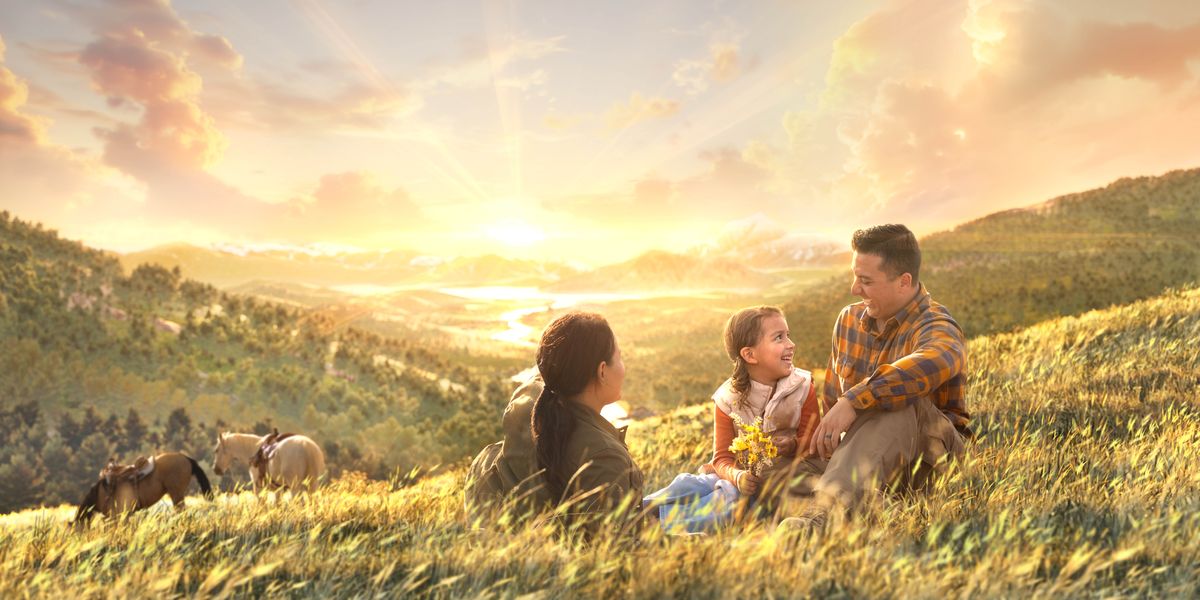 One family on top one hill sitting an laughing togedda wen da eart stay one paradise. Horses stay eating close to dem.