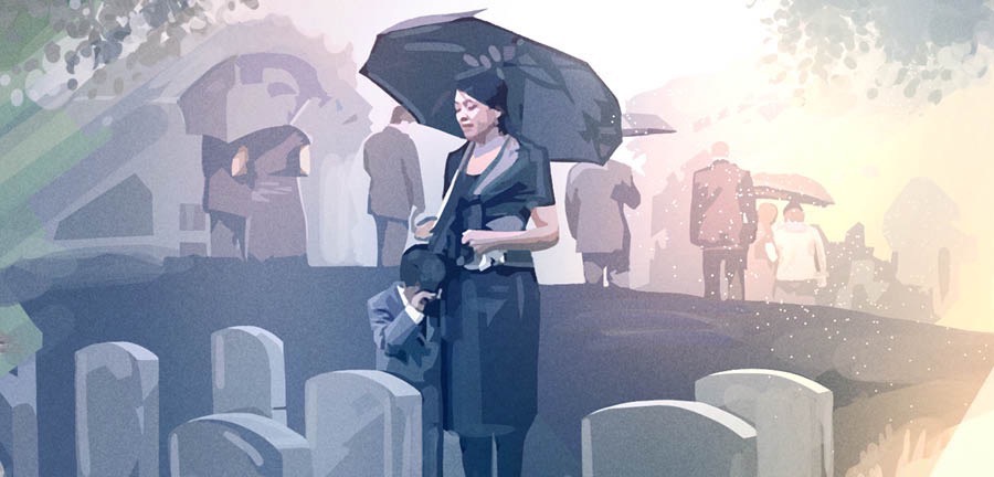 Persone in lutto in un cimitero