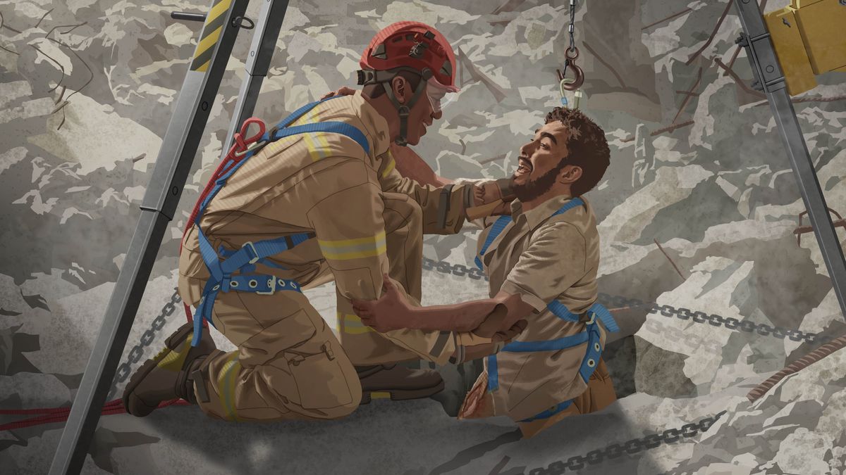 L’uomo dell’articolo precedente, che era intrappolato tra le macerie di un edificio, viene imbracato e tirato fuori da un soccorritore.