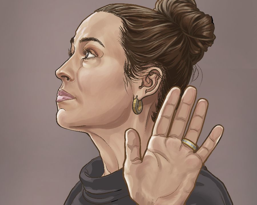 Una donna fa un gesto di rifiuto