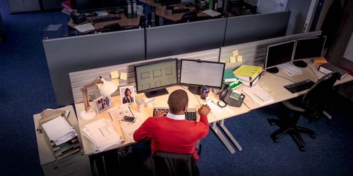 A man works late at night at his job