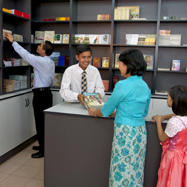 A ministerial servant helping with literature distribution