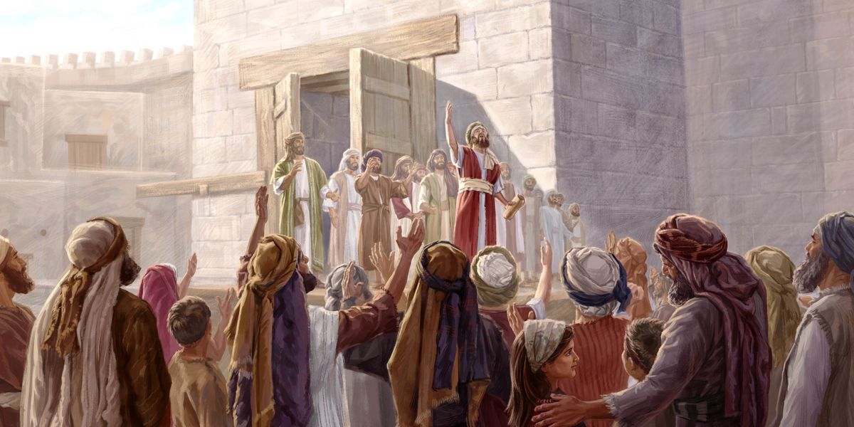 Di destê Ezra de tomarek heye, û ew li ber xelkê pesnê Yehowa dide.