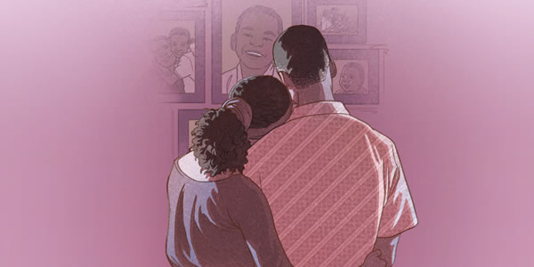 Parents looking at pictures of their young daughter who has died