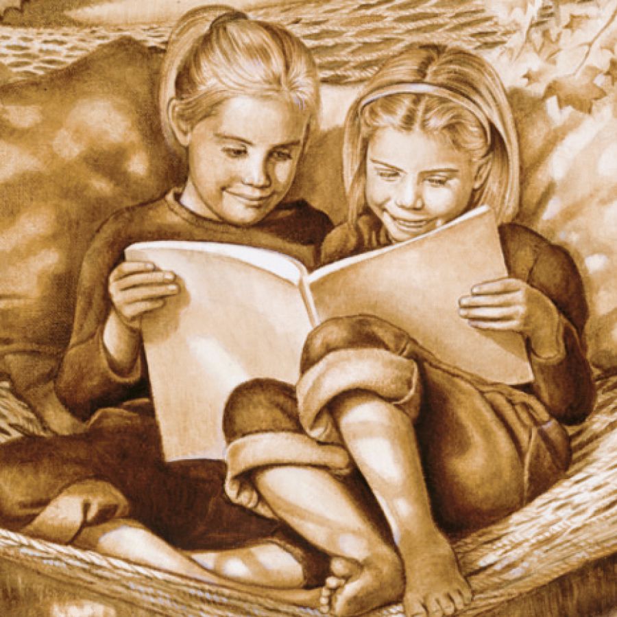 Две девочки вместе читают книгу