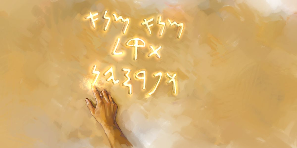A hand writes on the wall