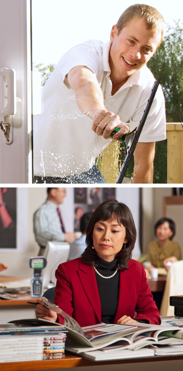 A man cleaning windows and a woman working in an office
