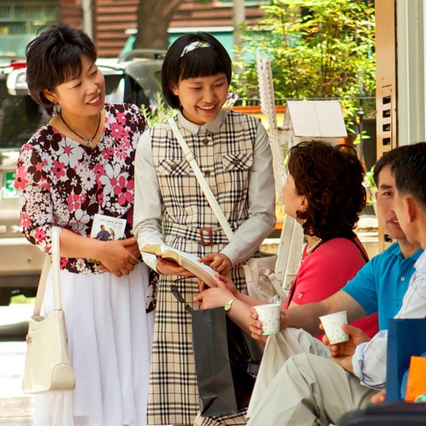 Two modestly-dressed women in the Christian ministry