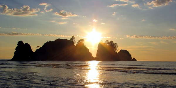 A beautiful sunset over an island and an ocean