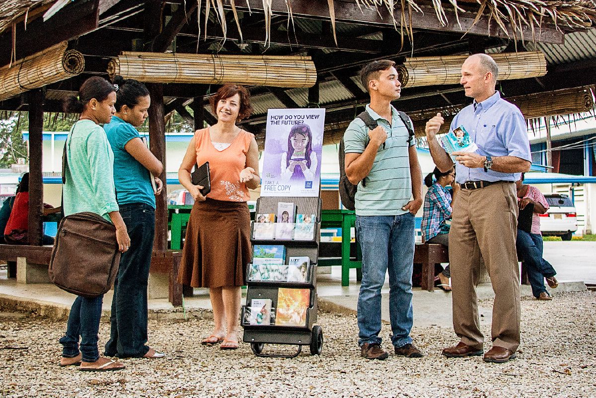A couple does public witnessing in a foreign country