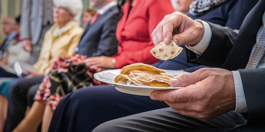 An anointed brother partaking of the bread during the Lord’s Evening Meal.