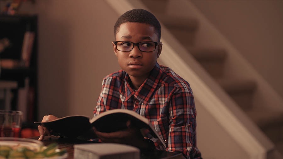 A scene from the video ‘Future Events That Will Require Courage.’ A young boy is worried after meditating on a depiction of Armageddon in the book ‘God’s Kingdom Rules!’