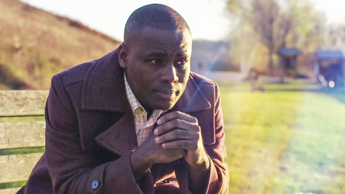 A scene from the video “We Can Rejoice Despite . . . Sword.” Brother Dugbe reflects on his experiences.