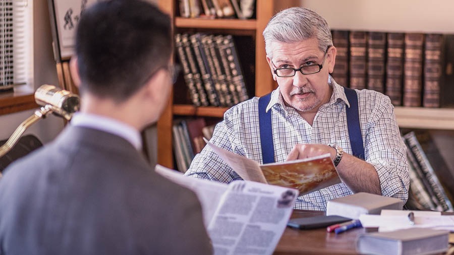 A brother discusses the Origin of Life brochure with his Bible student