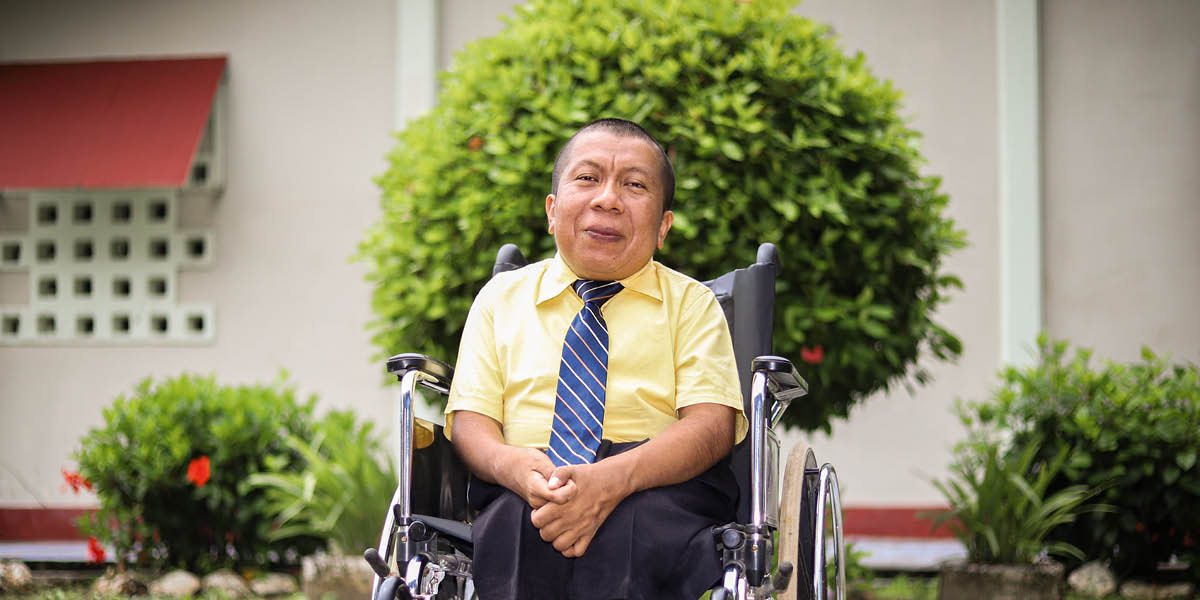 Mark Herman sitting in a wheelchair.