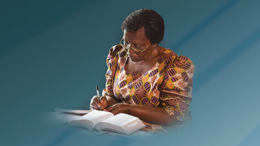 A sister sharing the good news by writing a letter.