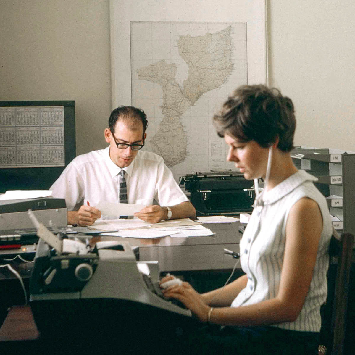 Keith and Anne working together in an office.