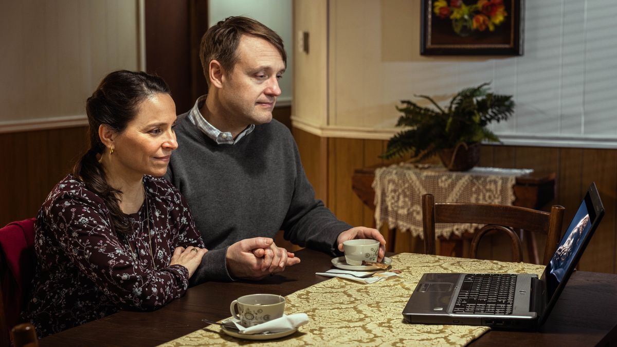 A couple watching the video “Daniel: A Lifetime of Faith.”