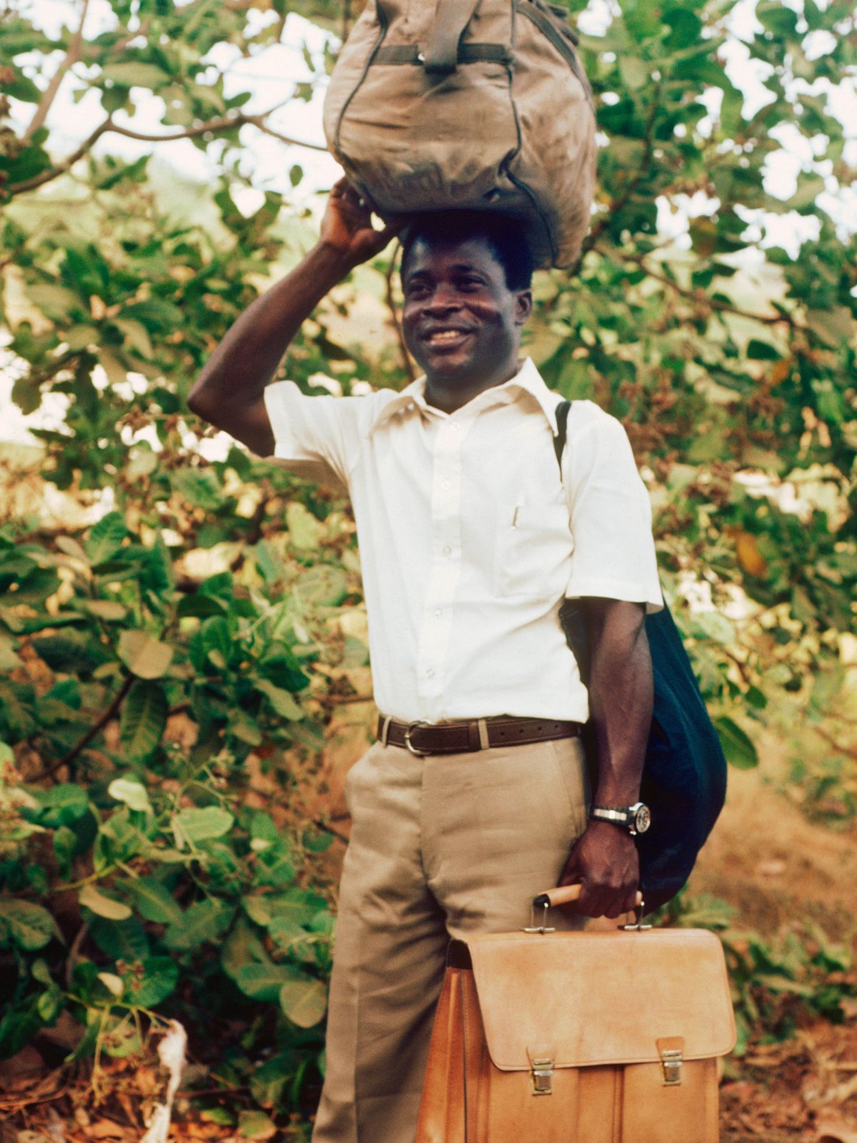 Israel happily carrying his belongings.