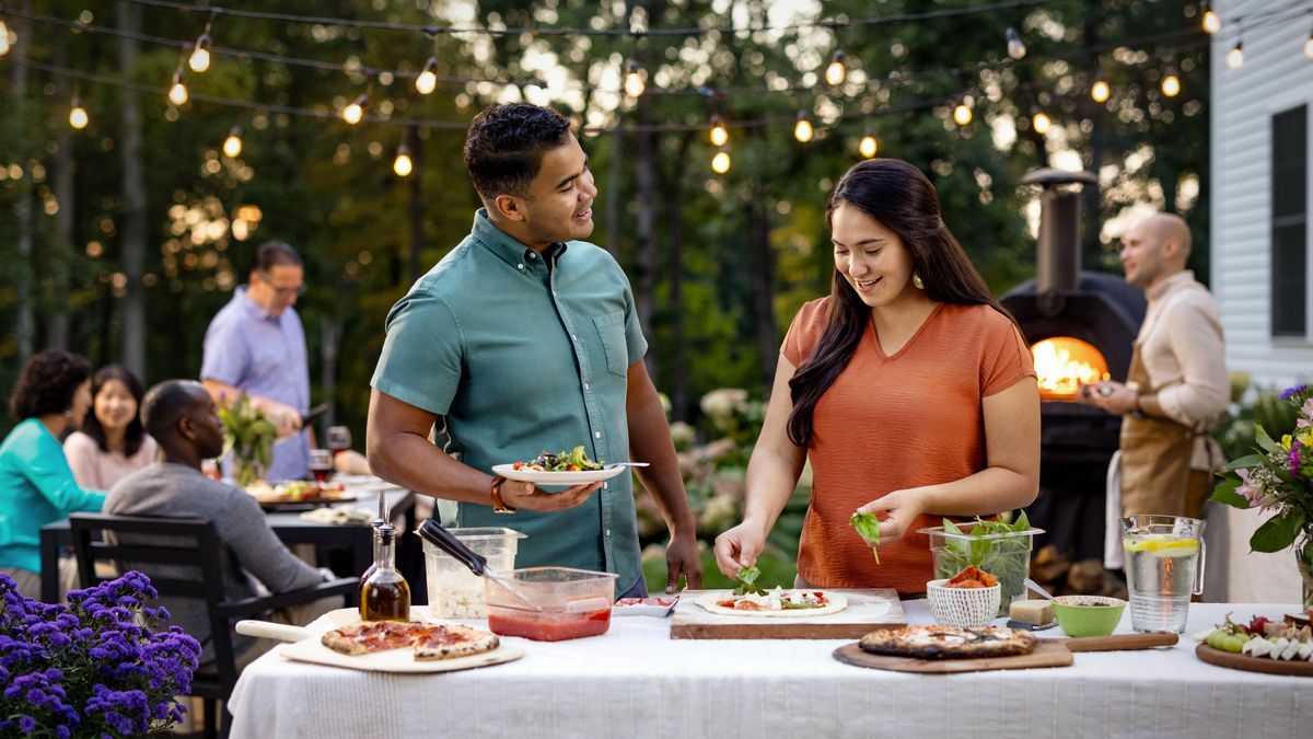 The single sister and brother conversing with each other at a social gathering.