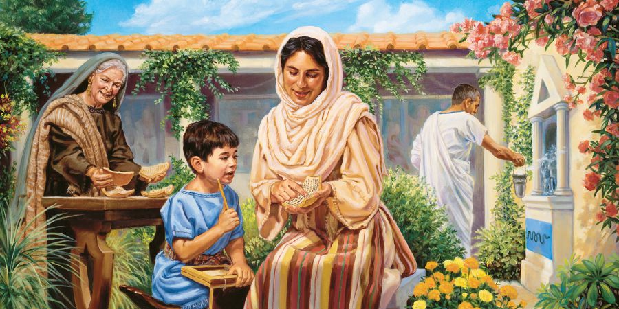 පුංචි තිමෝතිට යුනිස් උගන්වමින්, එයාගේ තාත්තා සහ ආච්චි ලොයිස් ඒ ළඟම ඉන්නවා