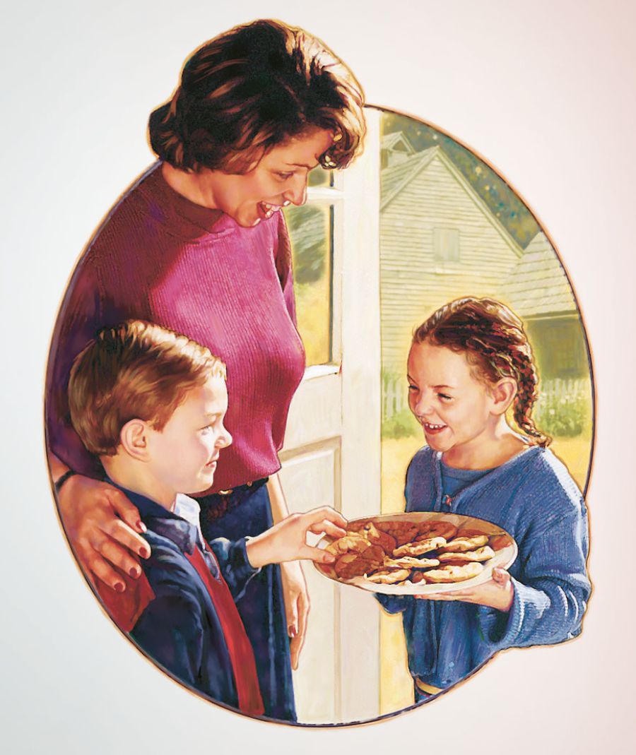 En flicka delar med sig av sina kakor till en pojke  och hans mamma